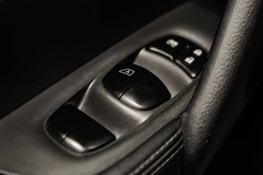 Novosibirsk, Russia - May 06, 2019:  Nissan Xtrail,close-up of the side door buttons: window adjustment buttons, door lock. Photography of a modern car on a parking in Novosibirs