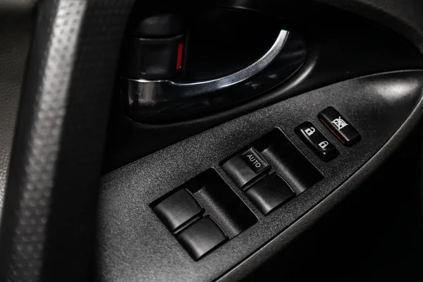 Close-up of the car  black and brown  interior: leather rear seats and seat belts .