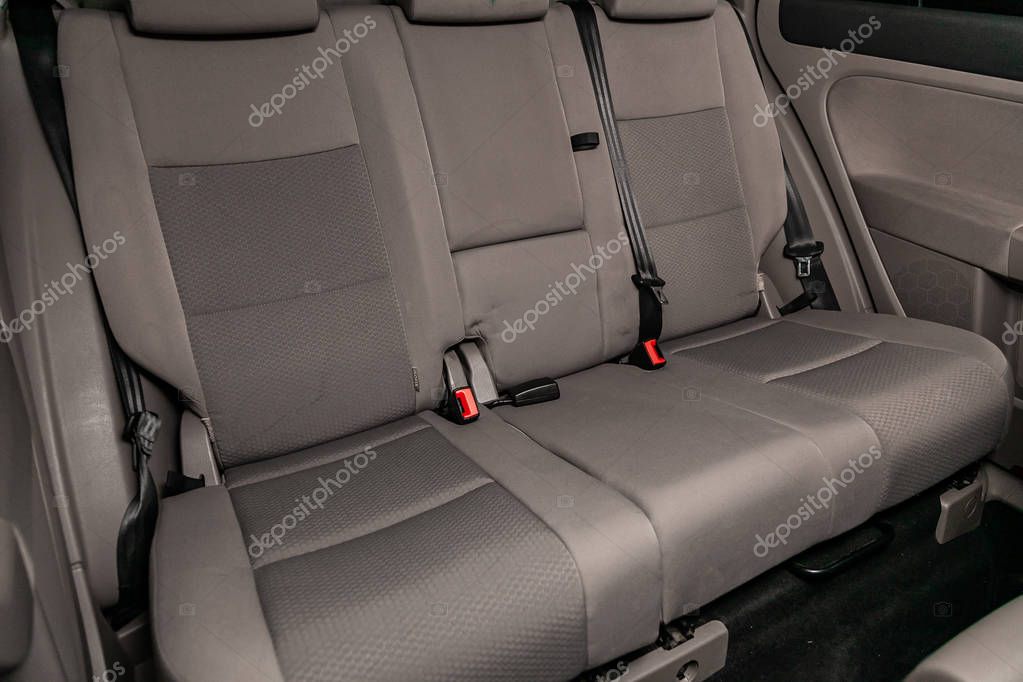 Novosibirsk, Russia   June 11, 2019:  Volkswagen Golf +, close-up of the gray rear seats with seats belt. modern car interio