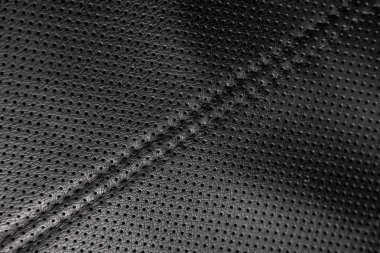 yakın çekim siyah delikli deri oto koltuğu. Cilt dokusu