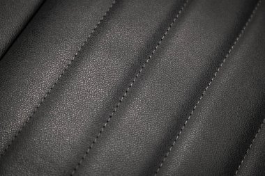 yakın çekim siyah delikli deri oto koltuğu. Cilt dokusu