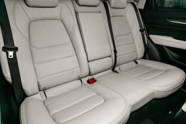 Novosibirsk, Russia  June 28, 2019:  Mazda CX-5, close-up of the white  rear seats with seats belt. modern car interior clipart