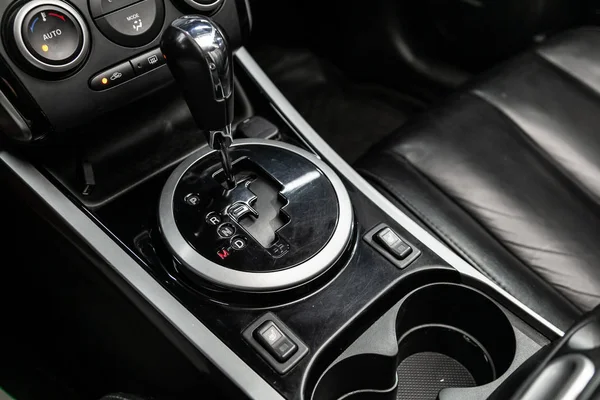 Close-up of the accelerator handle and seat heating  control buttons,. Automatic transmission gear of car , car interior