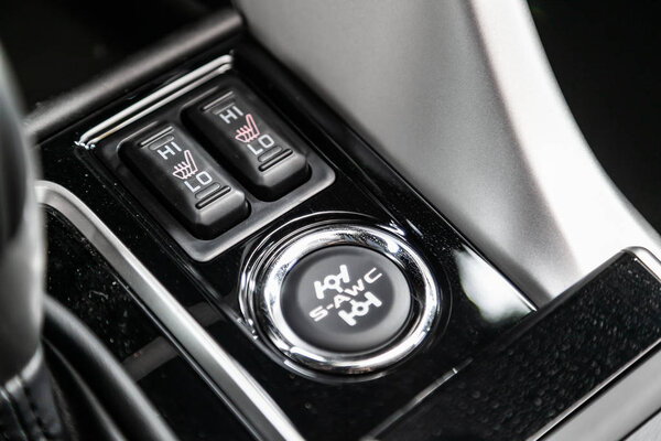 Novosibirsk, Russia  June 30, 2019:  Mitsubishi Eclipse Cross, close-up of seat heating buttons. modern car interior: parts, buttons, knob 