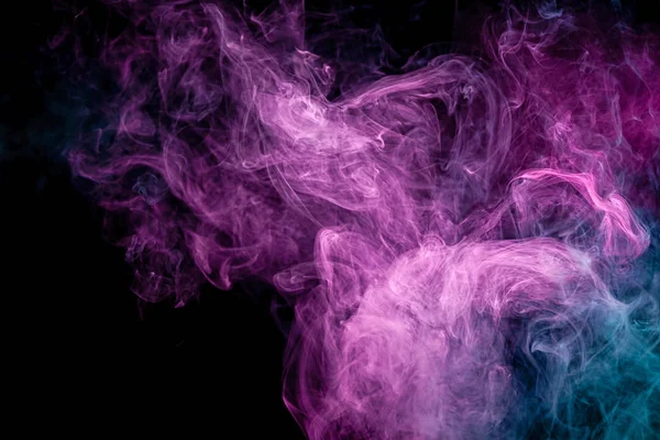 Pink and blue cloud of smoke of  black isolated background. Background from the smoke of vap