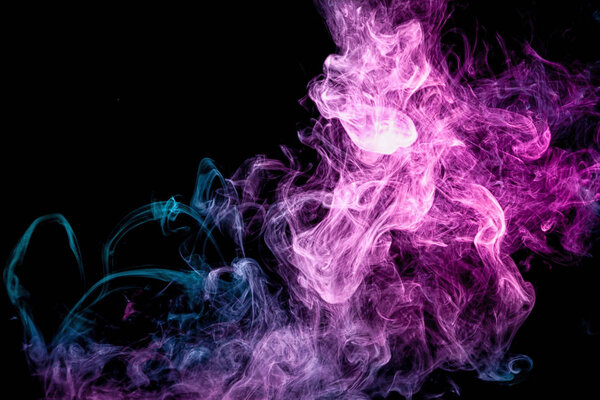 Blue and pink bomb smoke on black isolated backgroun
