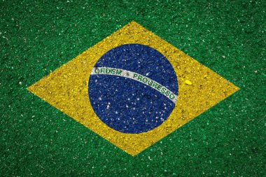 Taş bir arka plan üzerinde Brezilya Ulusal bayrağı. Ulusal gurur kavramı ve ülkenin sembolü.
