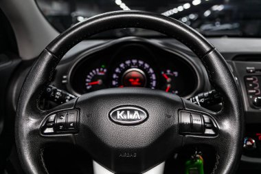 Novosibirsk, Russia  July 17, 2019:  Kia Sportage, close-up of the dashboard, speedometer, tachometer and steering wheel. . modern car interior clipart