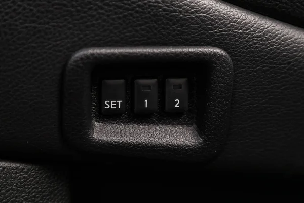 Close-up of seat adjustment buttons. modern car interior. modern car interior: parts, buttons, knob