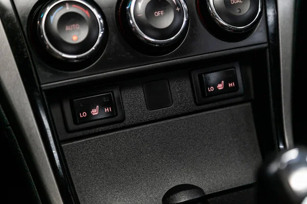 Close-up of seat heating buttons. modern car interior: parts, buttons, knob