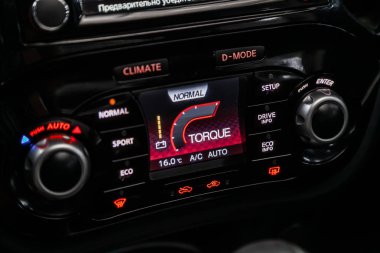 Novosibirsk, Russia  August 19, 2019: Nissan Juke, Modern black car interior: climat control view with air conditioning button, the dashboard with information about temperature inside a car clipart