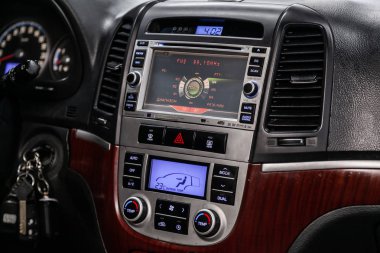 Novosibirsk, Russia  August 19, 2019: Hyundai Santa Fe,  luxury car Interior - steering wheel, shift lever, multimedia  systeme and dashboard clipart