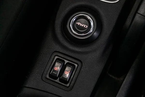 close-up of black of seat heating and 4 wd  buttons on car panel, no trade mark