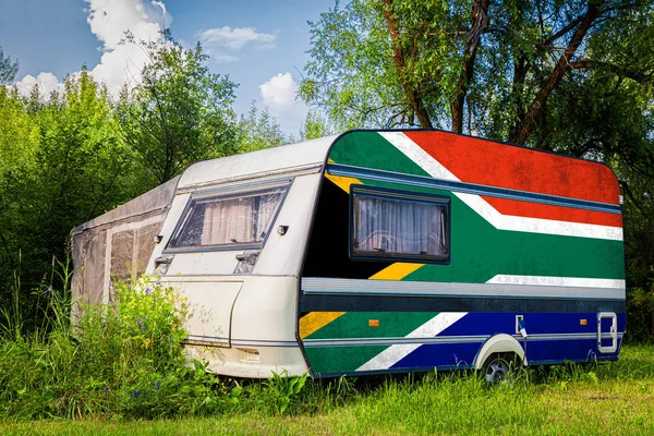 A car trailer, a motor home, painted in the national flag of  South African Republi
