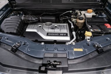 Novosibirsk, Russia  August 27, 2019:  Chevrolet Captiva, Close up detail of  car engine, front view. Internal combustion engine, car parts, deteylingr clipart