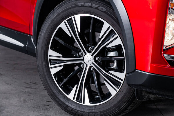 Novosibirsk, Russia  August 30, 2019:  Mitsubishi Eclipse Cross, close-up of the bumper, alloy wheel, car detailing  with sport break 
