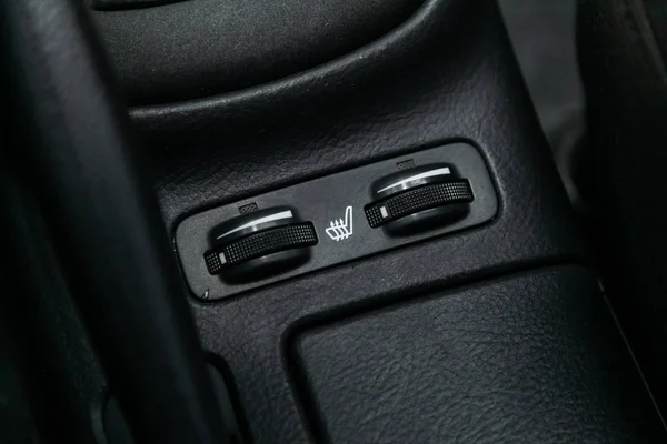 Seat heating indicator in the car included. modern car interior: parts, buttons, knob