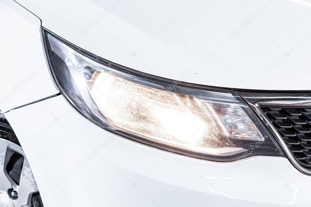 Close up of the car headlights. Exterior detail. Close up detail on one of the LED headlights modern car