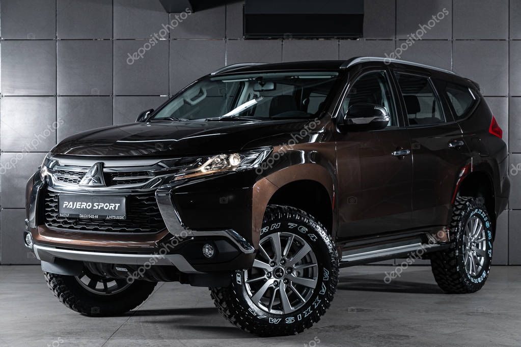 Novosibirsk, Russia  October 04, 2019:  new brown Mitsubishi Pajero Sport, front view.  Photography of a modern crossover made in Japan on a parking in Novosibirsk