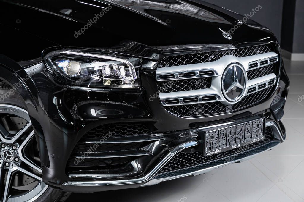 Novosibirsk/ Russia  April 11, 2020:  Mercedes-Benz GLS-class 400D, close-up of the headlight, bumper, wheel, logo radiator grille, hood.