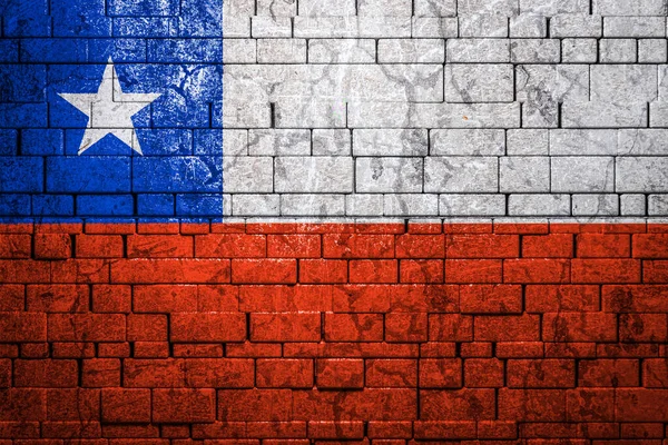National flag of Chile on brick  wall background.The concept of national pride and symbol of the country. Flag  banner on  stone texture background.