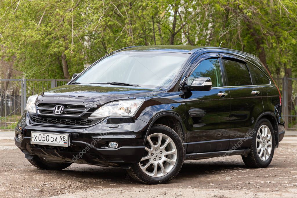 Novosibirsk/ Russia  May 02, 2020: black Honda CR-V, popular jeep  car parked outdoors on a warm summer day, front  view