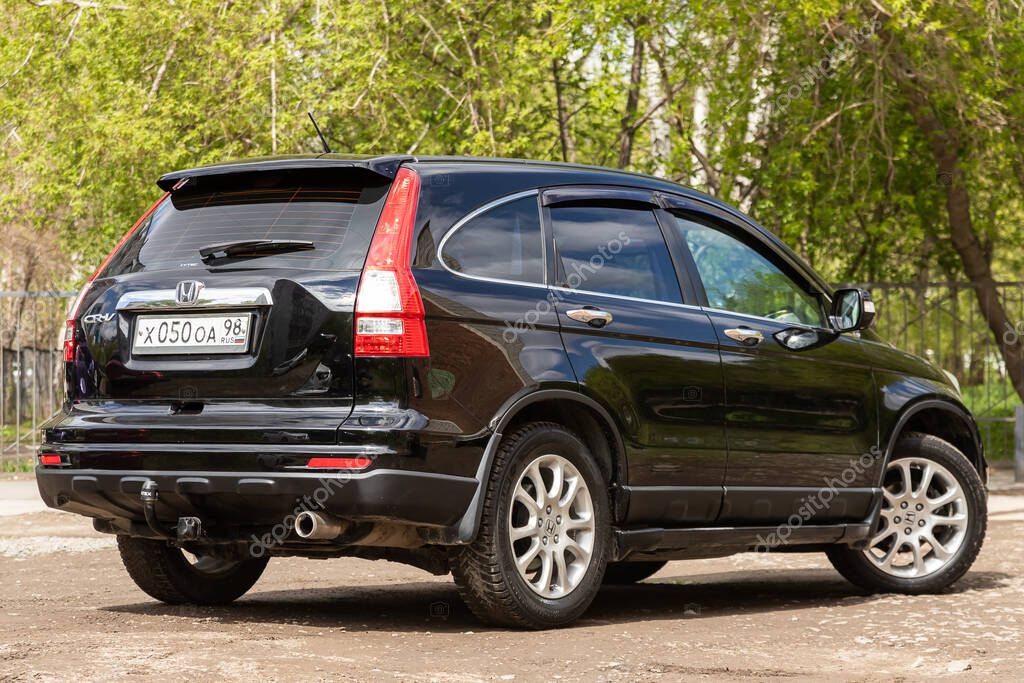 Novosibirsk/ Russia  May 02, 2020: black Honda CR-V, popular jeep  car parked outdoors on a warm summer day, back  view