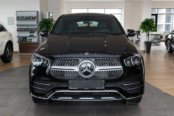 Novosibirsk/ Russia  April 28 2020: black Mercedes Benz GLE-class,  mid-range luxury SUV. New expensive  modern  crossover  on a parking on  light background 