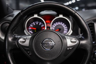 Novosibirsk/ Russia  June 10  2020:  Nissan Juke, Black luxury car Interior - dashboard, player, steering wheel with logo and buttons, speedometer and tachometer  clipart