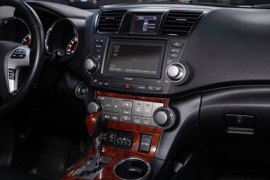 Novosibirsk/ Russia  April 28 2020: Toyota Highlander, close-up of the dashboard, player, steering wheel, accelerator handle, buttons, seats. modern car interior: parts, buttons, knob  clipart