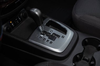 Novosibirsk/ Russia  July 26 2020: Hyundai Santa Fe, Close up of the manual gearbox transmission handle. Accelerator handle and buttons in a new car.  clipart