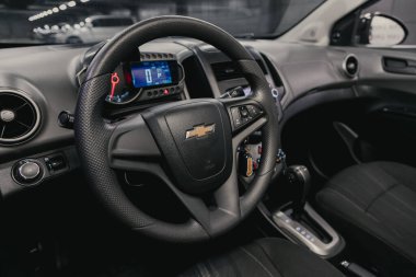 Novosibirsk/ Russia  August 25  2020: Chevrolet Aveo, Prestige car interior with dashboard, steering wheel, speedometer and tachometer. Black leather interior  clipart
