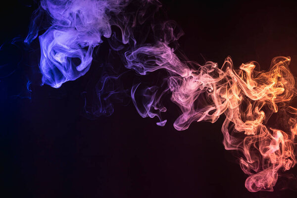 Pattern, Neon pink, blue and purple smoke in the on a dark isolated background. Background from the smoke of vap