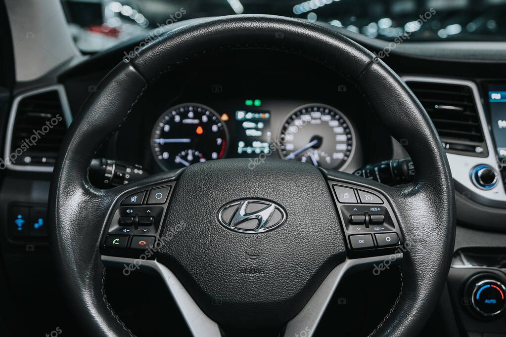Novosibirsk, Russia  October 08, 2020: Hyundai Tucson, Auto interior: steering wheel with  logo    and  speedometer and tachometer