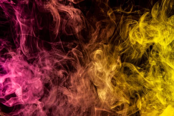 Frozen Abstract Movement Of Explosion Yellow And Pink Smoke Multiple Colors On Black Background Background From The Smoke Of Vape Light Concept Stock Photo 253074558