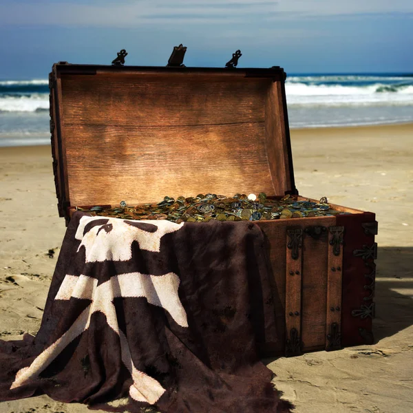 Pirate chest on the beach filled with gold coins . 3d rendering