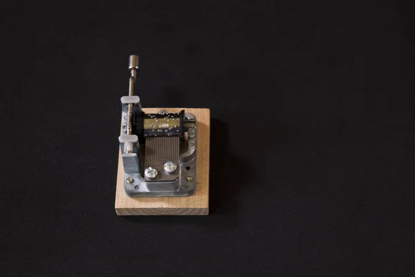 A beautiful vintage music box on a black background