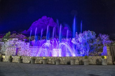 show lights and water funts PEA DE BERNAL- is a monolith in the Queretaro state of Mexico clipart
