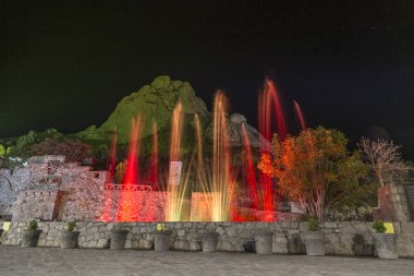 show lights and water funts PEA DE BERNAL- is a monolith in the Queretaro state of Mexico clipart