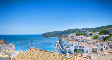 View on Street in Cadaques, Catalonia, Spain near of Barcelona. Scenic old town with nice beach and clear blue water in bay. Famous tourist destination in Costa Brava with Salvador Dali landmark clipart