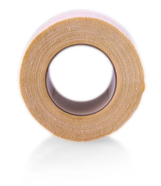 Roll of medical sticking plaster isolated on white