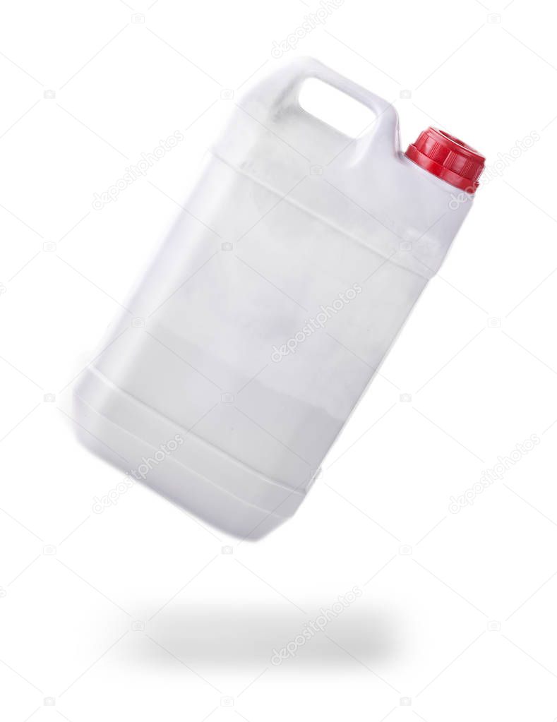 The white plastic container with red cap on white background