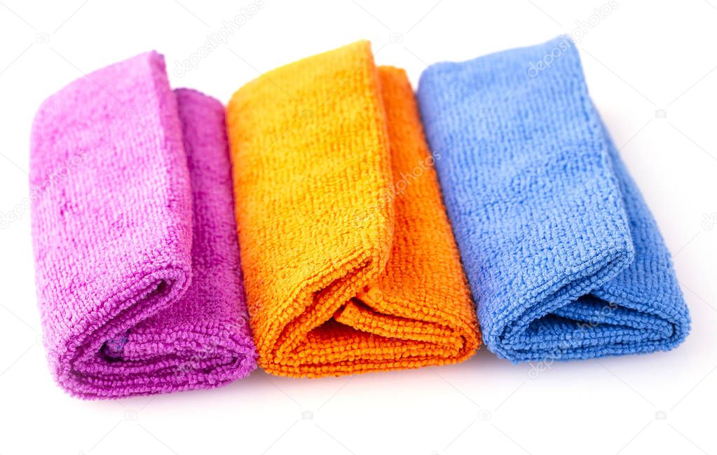 Stack of color microfiber cloths isolated on white background
