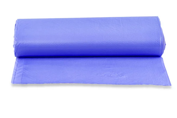 O rolo azul de sacos de lixo de plástico isolado no backgrou branco — Fotografia de Stock