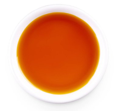 Beyaz arka planda izole beyaz küçük fincan Deniz topalak yağı