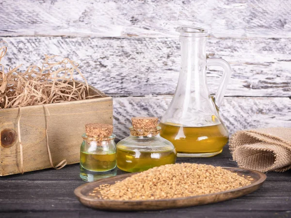 The Sesame oil in glass and seeds