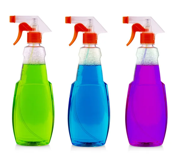 La botella de spray de color con líquido aislado sobre fondo blanco —  Fotos de Stock