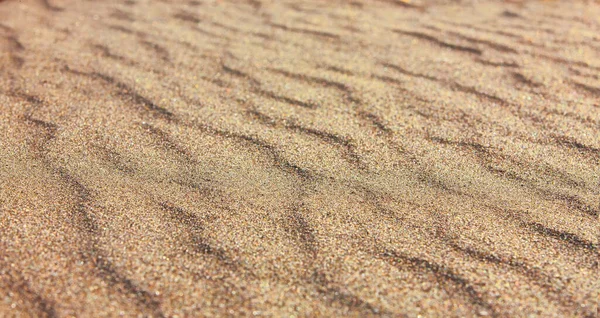 Padrão de areia de uma praia no verão — Fotografia de Stock