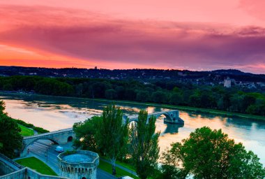 The Avignon old bridge and colorful sunset in Provence, France