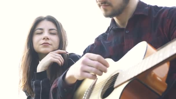 Man Playing Guitar Girlfriend Outdoor Girl Listening Song — Stock Video